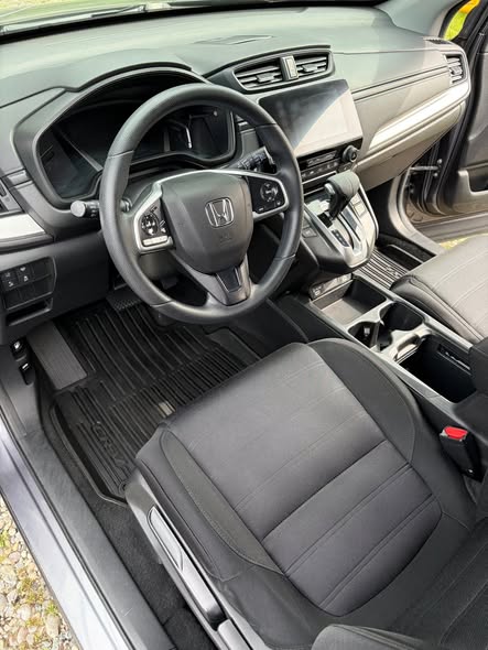 Clean Honda cabin showing detailed driver's seat, dashboard and floor area